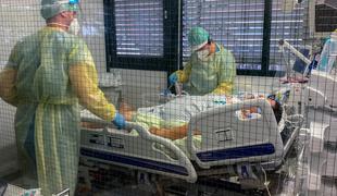 Koronavirus in kolaps zdravstva: število hospitaliziranih v tujini že blizu rekordov