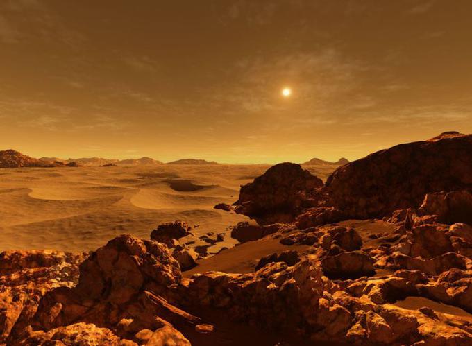 Sonce kuka skozi rdečkasto ozračje "rdečega planeta". Mars je od Sonca v povprečju oddaljen 228 milijonov kilometrov in je zadnji v tako imenovanem notranjem obroču planetov v Osončju. Do naslednjega planeta je od Marsa treba potovati kar … | Foto: Ron Miller
