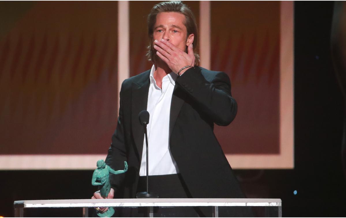 Brad Pitt | Brad Pitt je za vlogo v filmu Bilo je nekoč ... v Hollywoodu osvojil že tri velike nagrade: zlati globus, SAG in bafto. Po zadnjo ni mogel priti, zato je ponjo poslal Margot Robbie. | Foto Getty Images