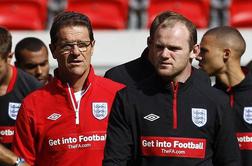 Rooney in Ferdinand želita Redknappa