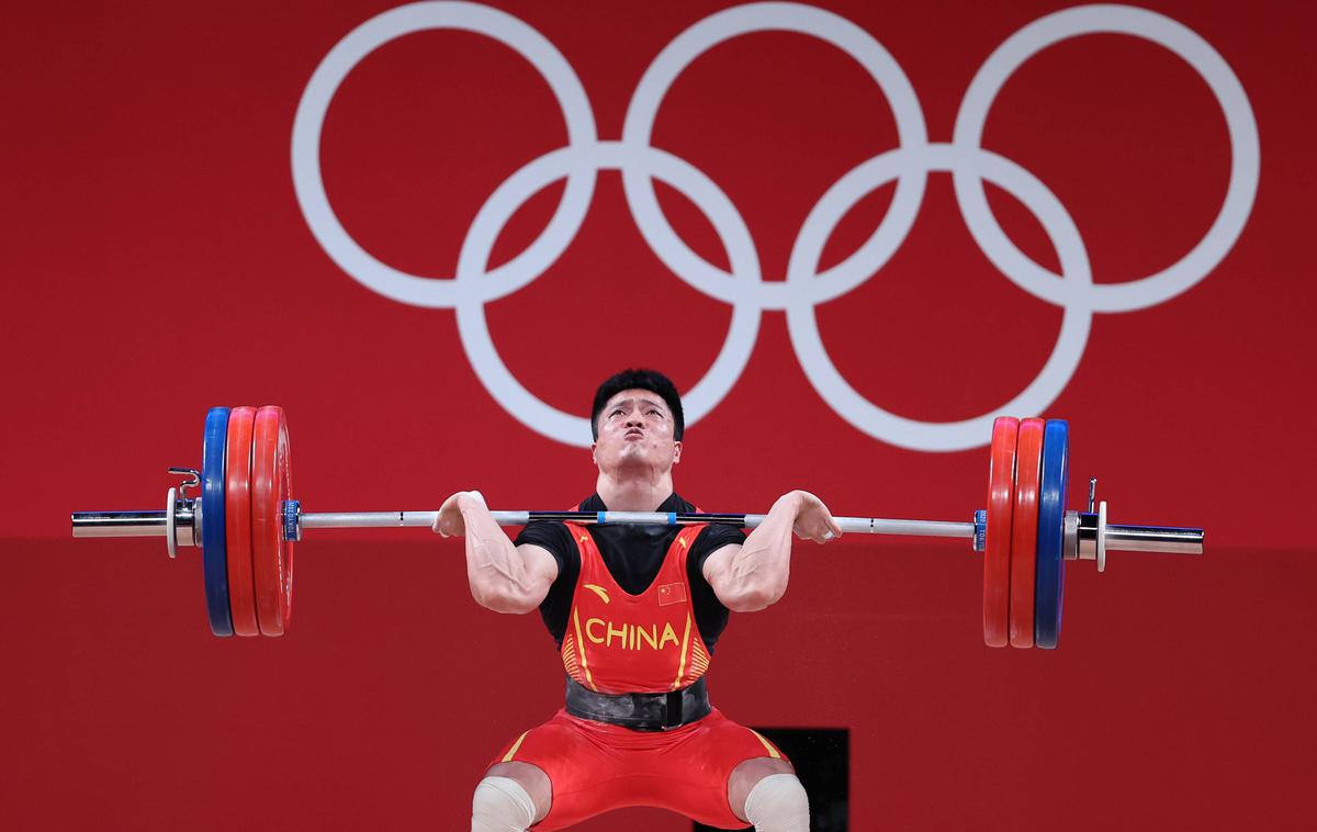 Li Fabin | Fabin Li je z novima olimpijskima rekordoma postal olimpijski prvak v kategoriji do 61 kilogramov. | Foto Guliverimage