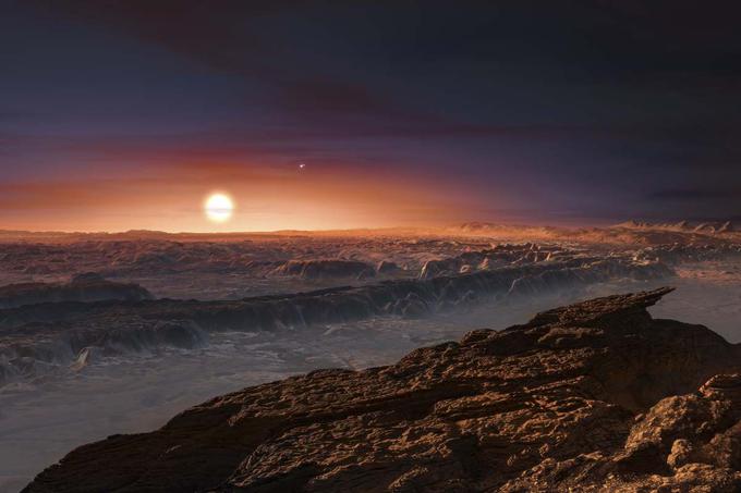 Čeprav je Zemlji najbližja zvezda, Proxime Centauri ne moremo videti s prostim očesom, ker je premalo svetla. Znanstveniki so pred enim mesecem sicer oznanili odkritje planeta v orbiti Proxime Centauri, poimenovali so ga Proxima b. To je pogled s površine tega planeta, kot si ga predstavlja umetnik ameriške vesoljske agencije Nasa. | Foto: Reuters