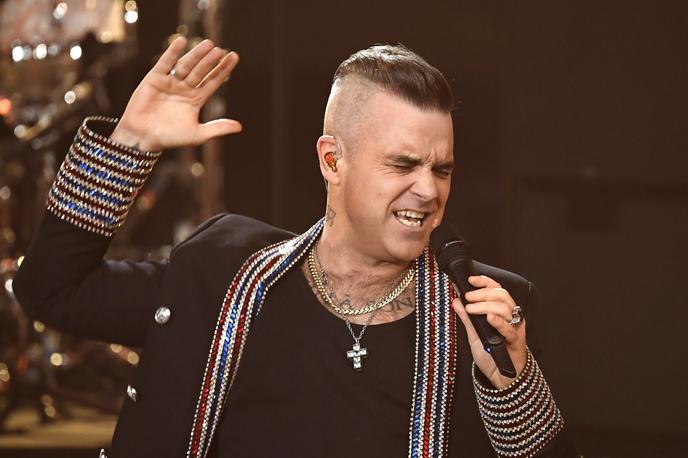 Robbie Williams | Robbie Williams je zaslovel kot član fantovske skupine Take That, leta 1995 pa je odšel na samostojno glasbeno pot. | Foto Guliverimage/AP