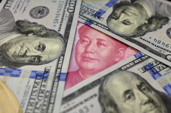 Kitajski dolgoročni cilj je, da bi njihova valuta juan izpodrinila ameriški dolar kot najpomembnejšo rezervno valuto. | Foto: Reuters