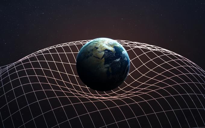 Za lažje razumevanje gravitacijskega valovanja: če si vesolje predstavljamo kot velikansko rjuho, na katero položimo težko kroglo, bo ta upognila del rjuhe okrog sebe (primer na zgornji fotografiji). Če nato proti njej zakotalimo še eno kroglo, je ne bo obšla v ravni črti, temveč bo začela krožiti okrog nje. S približevanjem druge krogle prvi bo rjuha začela valovati, dokler se krogli ne bosta dotaknili. | Foto: Thinkstock