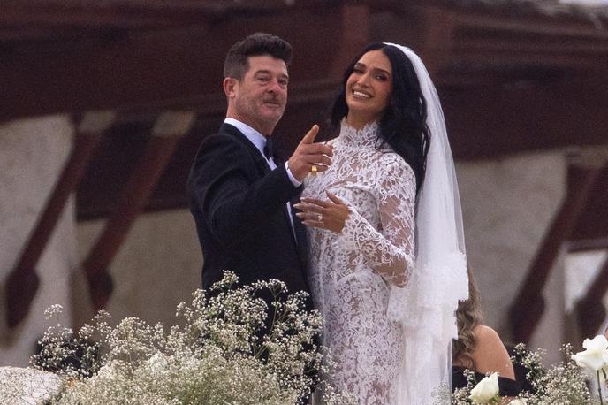 Robin Thicke in April Love Geary, poroka | Zaradi precejšne starostne razlike – loči ju namreč 18 let – sta se morala v javnosti že večkrat "zagovarjati", a zvezo, ki sta jo zdaj okronala še s poroko, uspešno krmarita že več kot desetletje. | Foto Profimedia