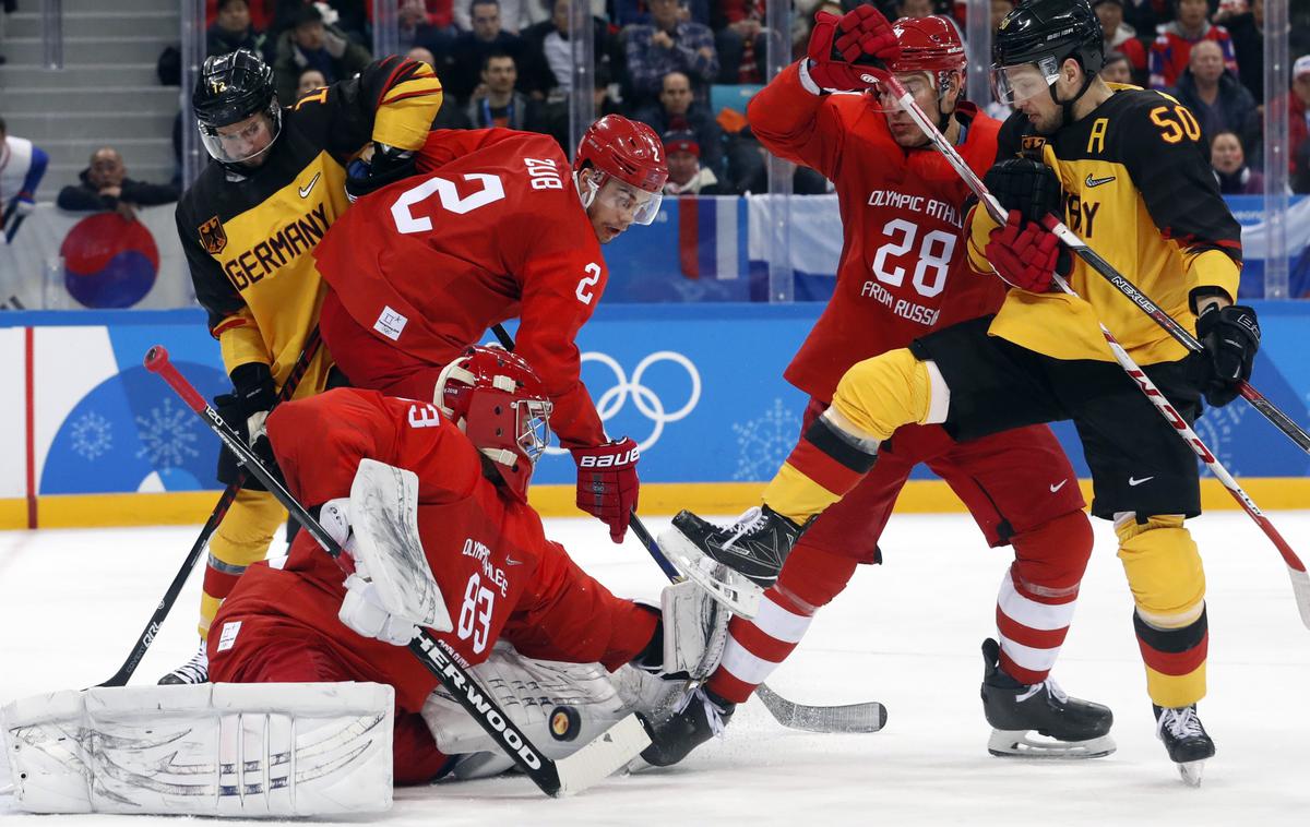 Rusija Nemčija finale OI Pjongčang | Pri Mednarodni hokejski zvezi pravijo, da obstajajo štiri možnosti za hokejski olimpijski turnir v Pekingu leta 2022. Črn scenarij predvideva, da hokeja sploh ne bi gledali, a vanj verjame le malokdo. | Foto Reuters