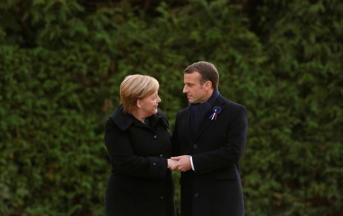 Merkel Macron | Merklova in Macron sta s podpisom dokumenta na 56. obletnico sklenitve elizejske pogodbe potrdila nov dogovor o prijateljstvu in krepitvi že tako tesnih odnosov med državama. | Foto Reuters