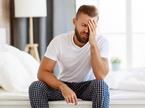 tired-man-by-bed