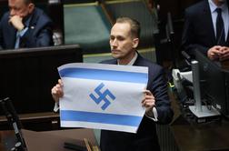 Škandal v parlamentu: poslanec razkazoval izraelsko zastavo s svastiko #video