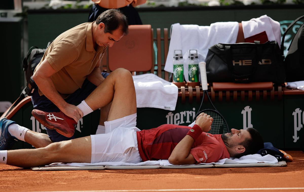 Novak Đoković | Novak Đoković se je poškodoval na letošnjem OP Francije. Sam meni, da zaradi spolzkega igrišča. | Foto Guliverimage