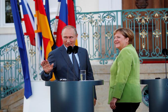 Vladimir Putin in Angela Merkel | Foto: Reuters