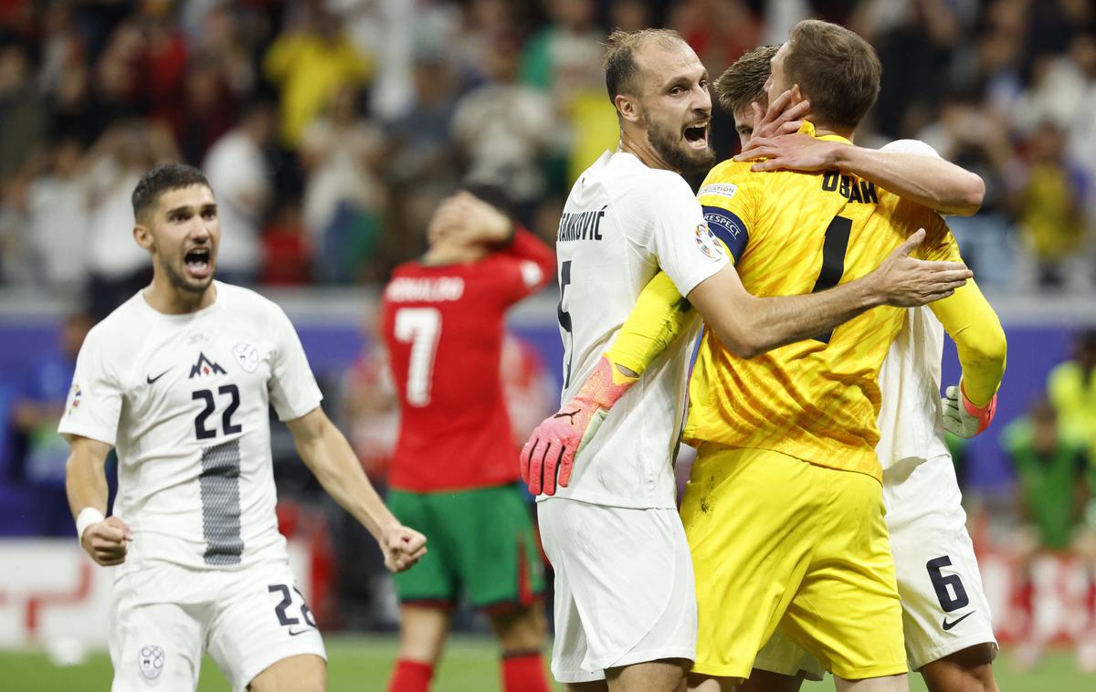 Slovenija Portugalska | Trenutek nepopisne sreče slovenske reprezentance, ko je Jan Oblak ubranil enajstmetrovko Cristianu Ronaldu. | Foto Reuters