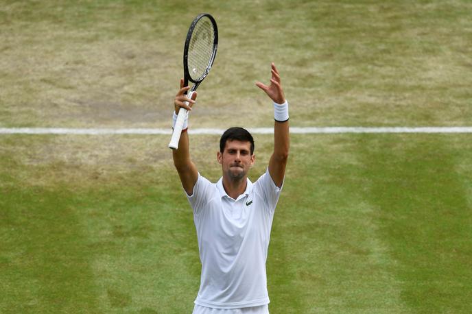 Novak Đoković | Novak Đoković si je polfinale zagotovil v manj kot dveh urah. Nasproti mu bo stal Španec Roberto Bautista Agut. | Foto Reuters