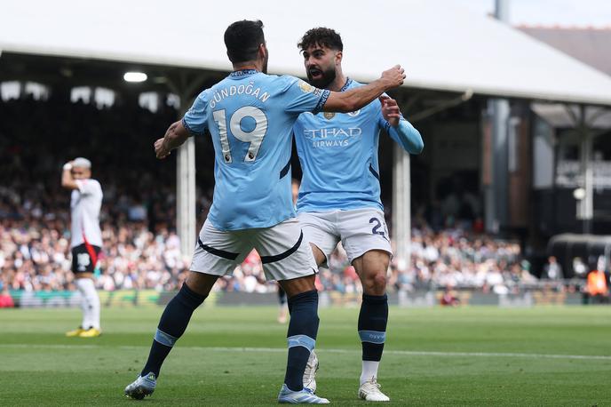 Fulham Manchester City Ilkay Gundogan | Ilkay Gundogan je popeljal Manchester City v vodstvo v Londonu. Tako se je veselil zadetka skupaj s Hrvatom Joškom Gvardiolom. | Foto Reuters