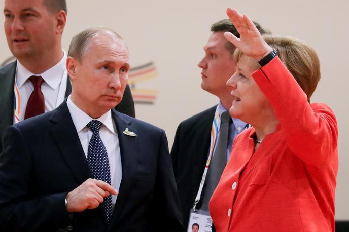 Vladimir Putin in Angela Merkel | Foto Reuters