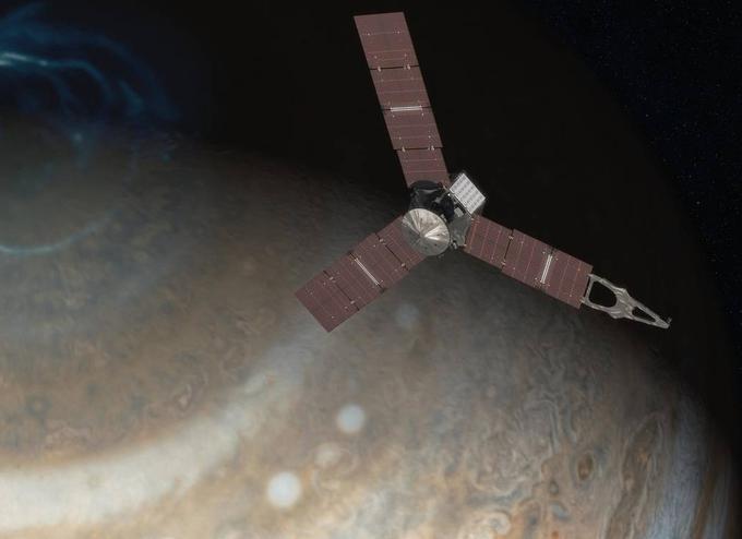 Vesoljsko plovilo Juno med preletom plinastega velikana Jupitra. | Foto: Reuters