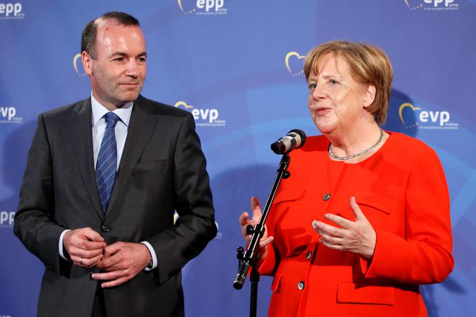 Manfred Weber in Angela Merkel | Vodja poslancev EPP Manfred Weber in nemška kanclerka Angela Merkel. | Foto Reuters