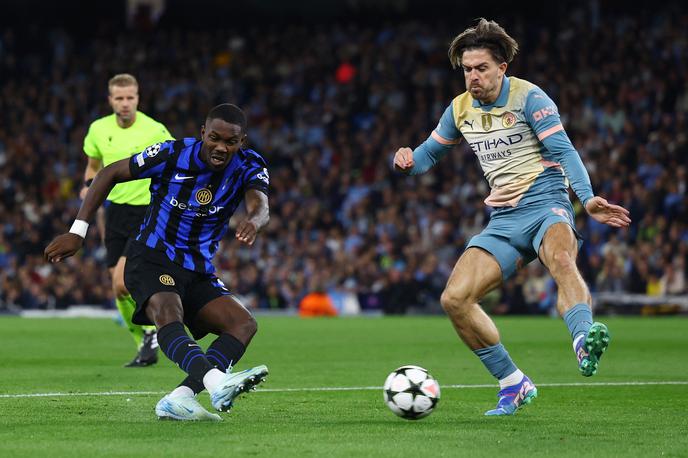 Manxchester City Inter Milan Jack Grealish Marcus Thuram | Prav vidite, to je Jack Grealish s tekme proti Interju. Man City nastopa v sila nenavadnih dresih. | Foto Reuters