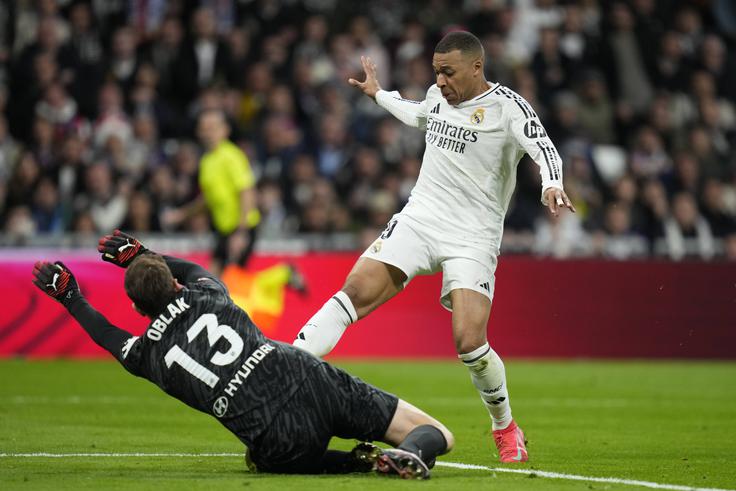 Danes se bosta Kylian Mbappe in Jan Oblak prvič spopadla v ligi prvakov v madridskem mestnem obračunu. | Foto: Guliverimage