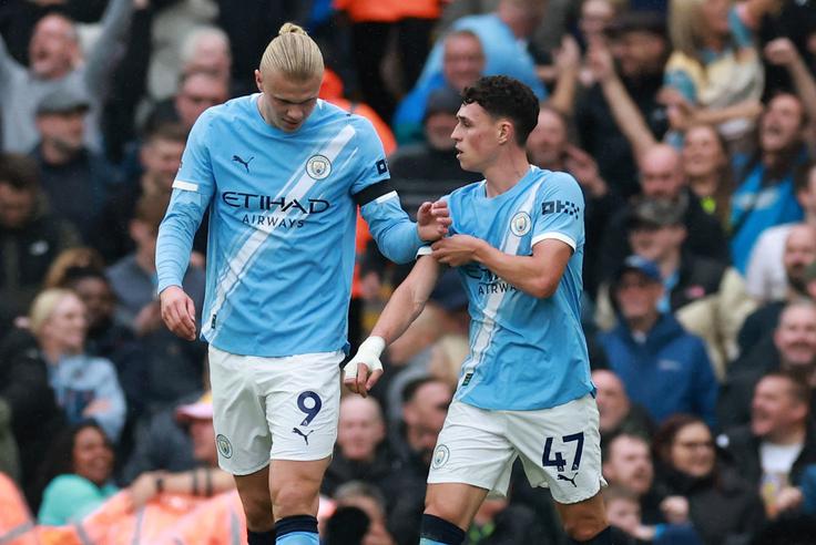 Erling Haaland in Phil Foden sta zatresla mrežo blededa Uniteda. | Foto: Reuters