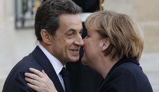 Merklova in Sarkozy za sankcije za države s presežnim primanjkljajem