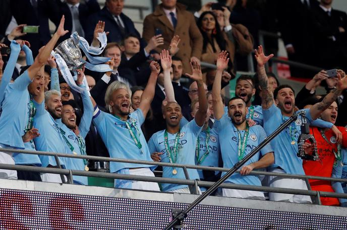 Manchester City | Nogometaši Manchester Cityja se drugo leto v nizu veselijo naslova v angleškem ligaškem pokalu. | Foto Reuters