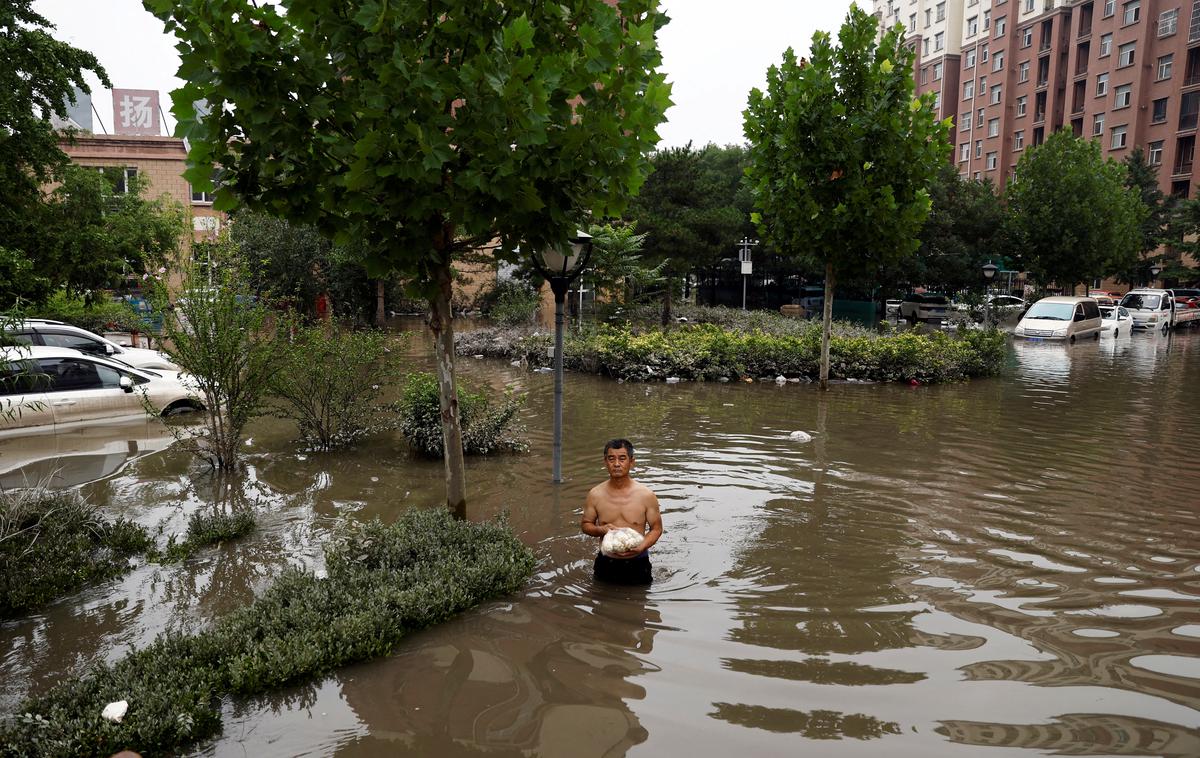 Kitajska, poplave | Državo bo predvidoma konec tedna zajela nova nevihta, imenovana Khanun, ki je bila še do nedavnega kategorizirana kot tajfun. | Foto Reuters