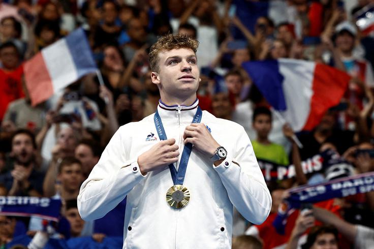 Njegovo poletje 2024 so zaznamovali štirje olimpijski naslovi v bazenu La Defense. | Foto: Reuters