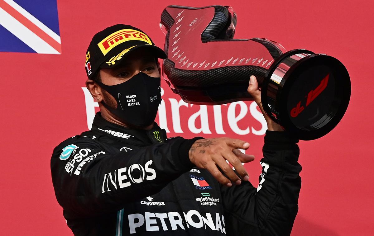 Lewis Hamilton | Lewis Hamilton v Imoli slavi že svojo 93. zmago v formuli ena. | Foto Reuters