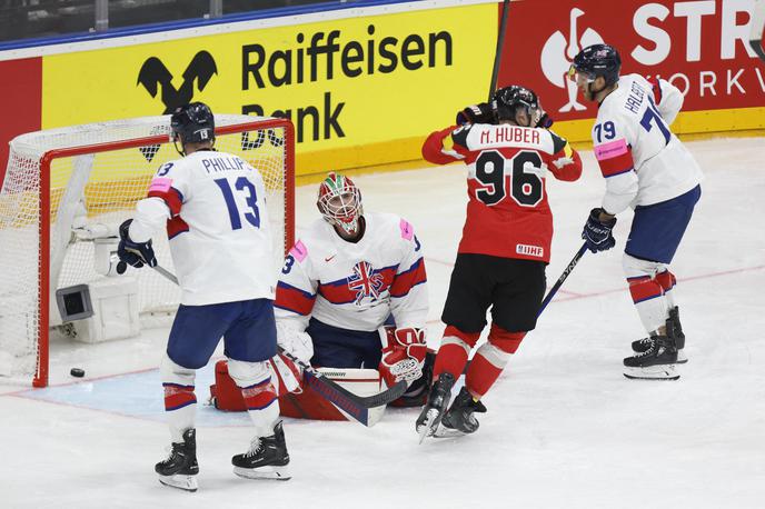 SP v hokeju 2024: Velika Britanija : Avstrija | Avstrijci po porazu z Veliko Britanijo, ki se seli v nižji tekmovalni rang, nimajo več možnosti za četrtfinale. Tekmovanje bodo končali na petem mestu skupine A v Pragi, s tem pa so si zadnjo četrtfinalno vstopnico v tej skupini zagotovili Finci. | Foto Reuters