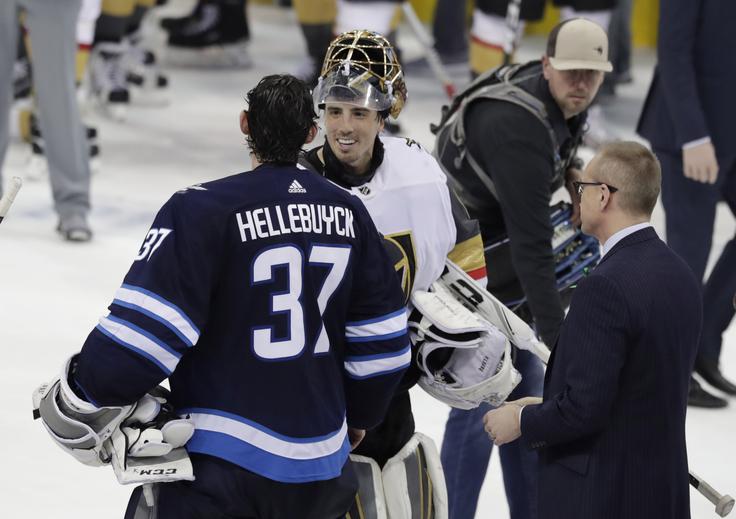 Vratar Connor Hellebuyck je športno segel v roke Fleuryju, enemu ključnih igralcev Vegasa. Bo prekaljeni vratarski maček osvojil tretji zaporedni, skupno pa četrti Stanleyjev pokal? | Foto: Reuters