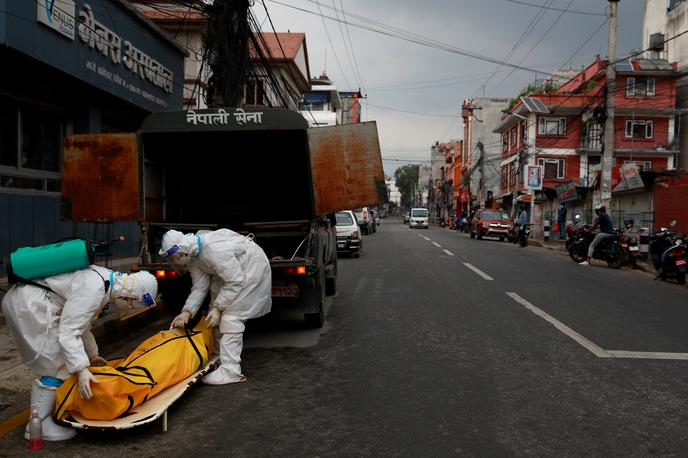 Indija covid-19 | V zadnjih 24 urah je v Indiji zaradi bolezni covid-19 umrlo najmanj 4.187 ljudi. | Foto Reuters