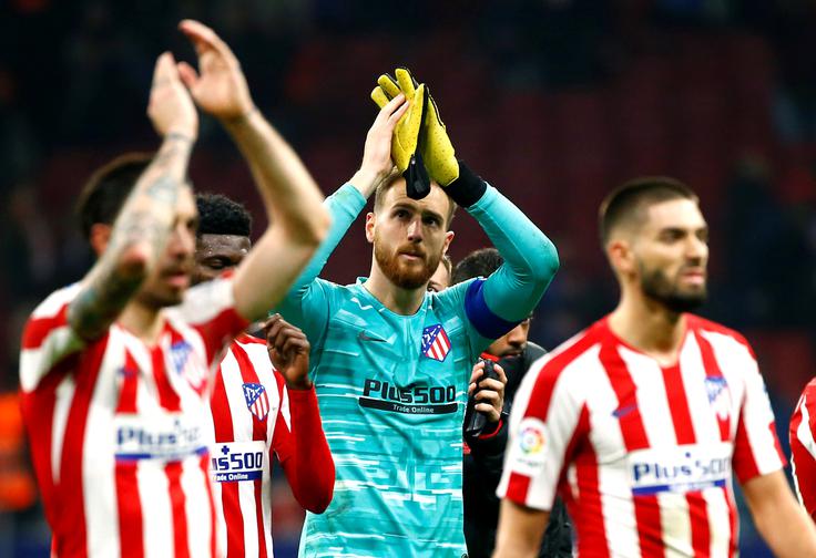 Jan Oblak s soigralci Atletica ne bo igral nogometnih tekem vsaj do 28. maja. | Foto: Reuters