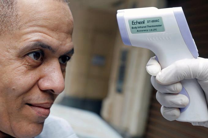 Merjenje temperature, koronavirus | Foto: Reuters