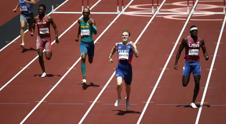 V finalu 400 metrov z ovirami so rekordi padali kot po tekočem traku. | Foto: Reuters