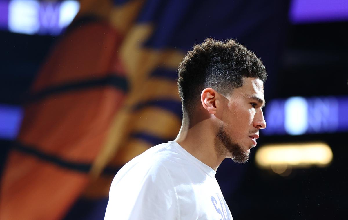 Devin Booker | Košarkarsko moštvo Phoenix Suns se bo moralo še najmanj dve tekmi znajti brez Devina Bookerja.  | Foto Reuters