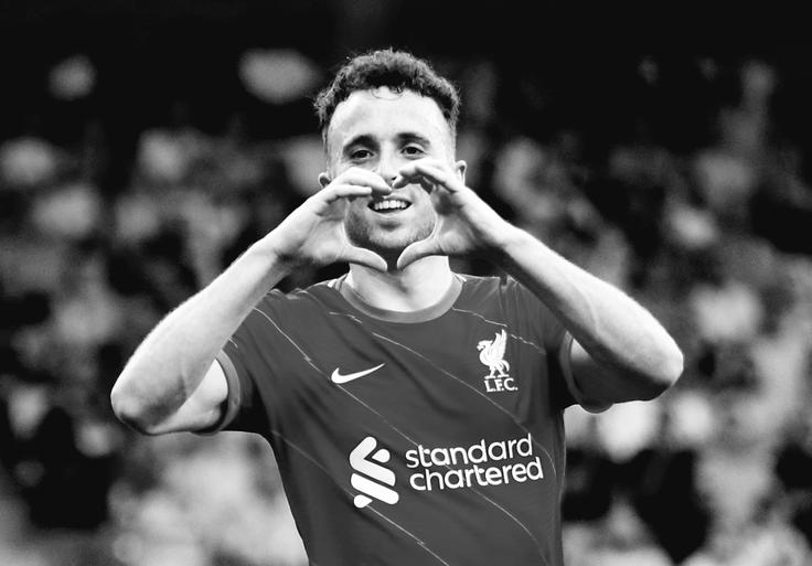 Diogo Jota je bil pomemben člen šampionske zasedbe Liverpoola in portugalske izbrane vrste. | Foto: Reuters