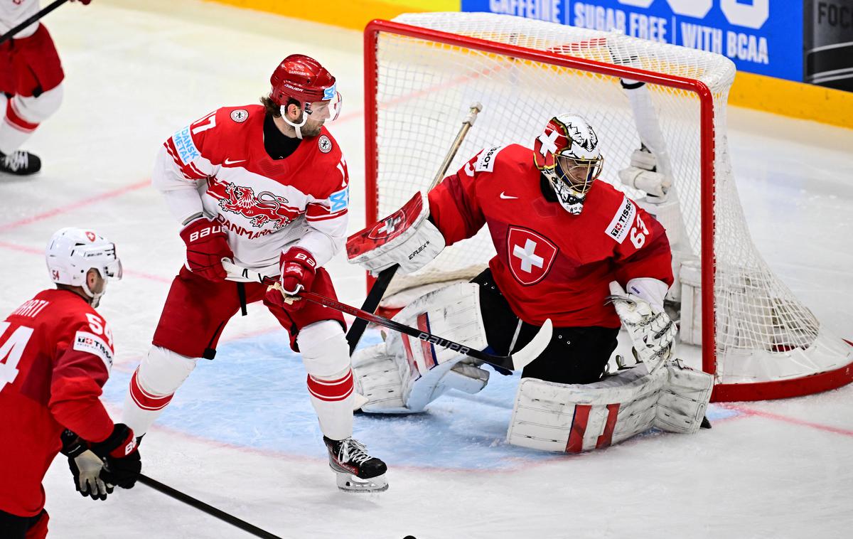 SP v hokeju: Švica - Danska | Danci, ki so v četrtfinalu SP senzacionalno izločili veliko Kanado, so v polfinalu naleteli na pretrd švicarski oreh. | Foto Reuters