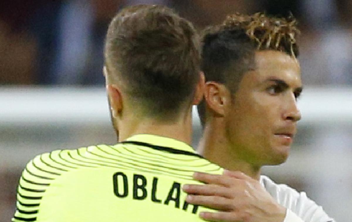 Cristiano Ronaldo Jan Oblak | Foto Reuters