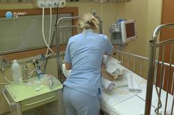 Razsajajo bolezni dihal, na infekcijski kliniki ležijo tudi na hodnikih (video)