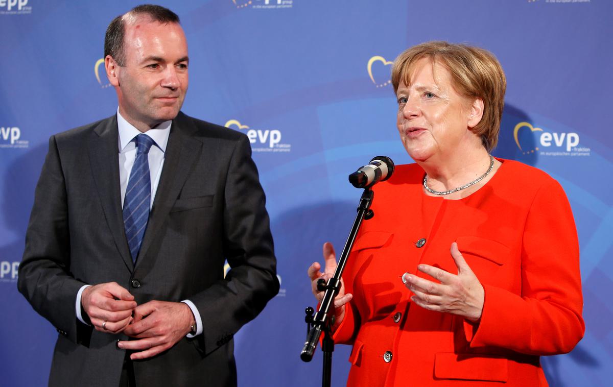 Manfred Weber in Angela Merkel | Vodja poslancev EPP Manfred Weber in nemška kanclerka Angela Merkel. | Foto Reuters