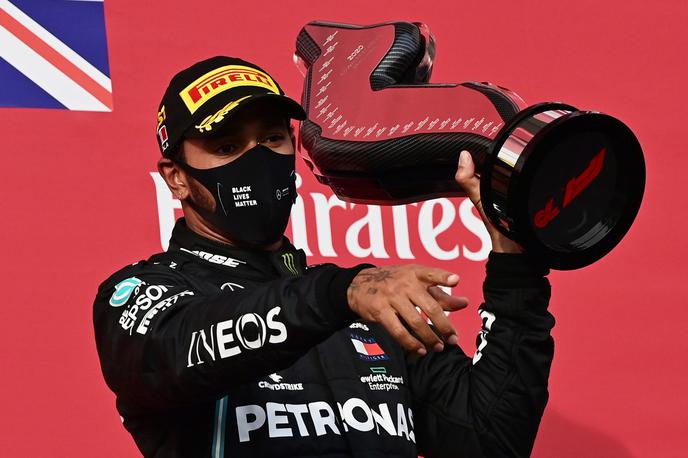 Lewis Hamilton | Lewis Hamilton v Imoli slavi že svojo 93. zmago v formuli ena. | Foto Reuters
