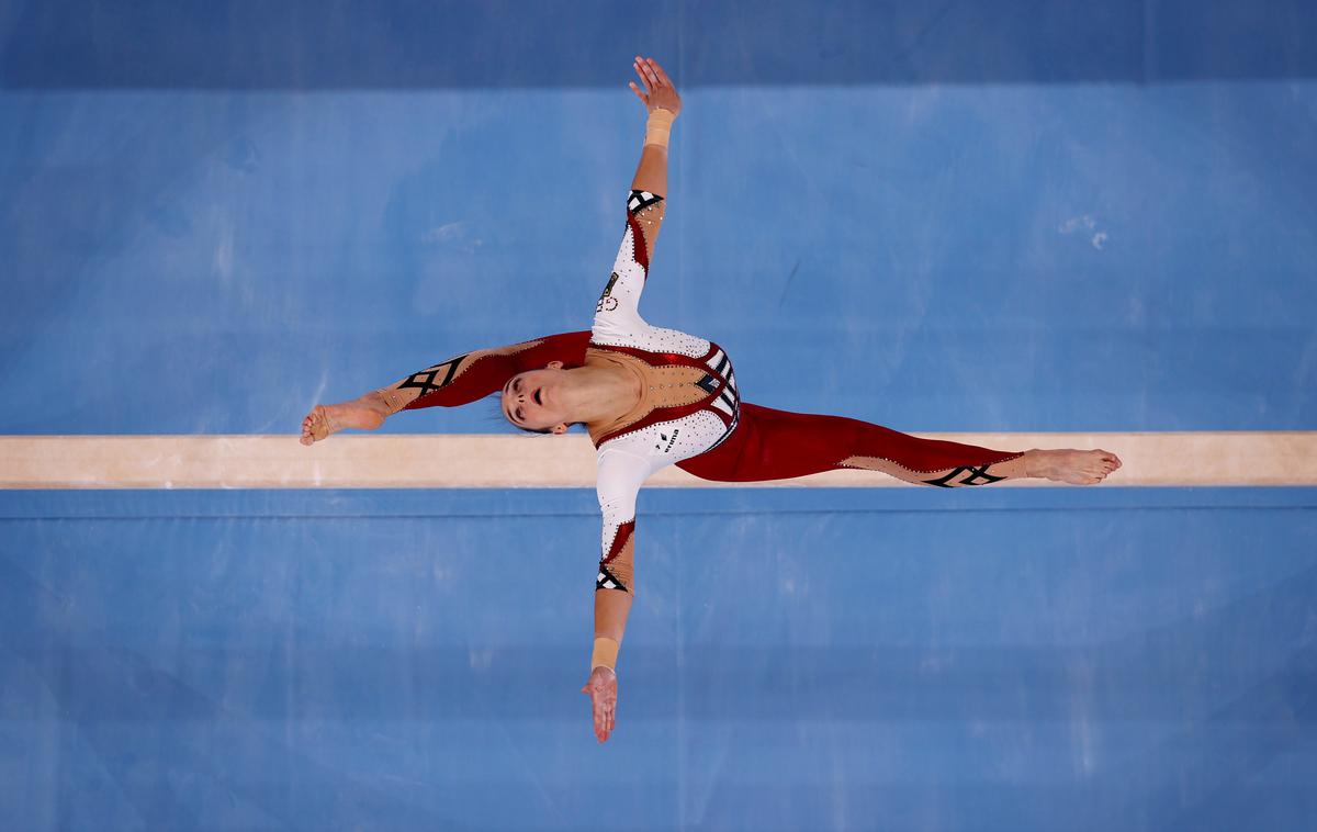 nemške gimnastičarke | Nemška gimnastičarka Pauline Schäfer je s kolegicami raje izbrala dres, ki zakriva noge. | Foto Reuters