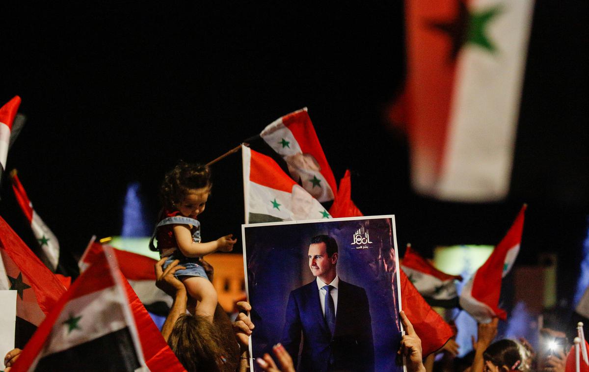 Bašar al Asad | Privrženi Bašarja Al Asada med praznovanjem njegove zmage na volitvah. | Foto Reuters
