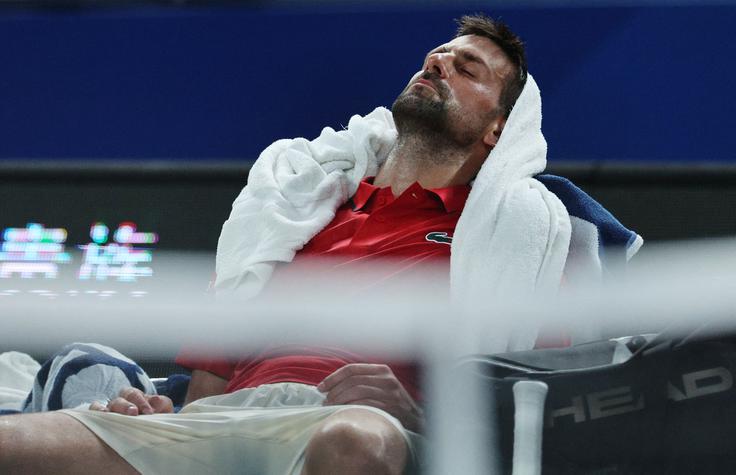 Novak Đoković ob premorih. | Foto: Reuters