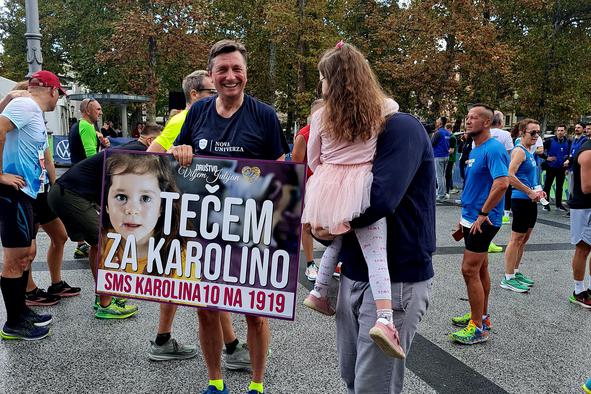 Kdo je deklica, za katero je v nedeljo tekel Borut Pahor?