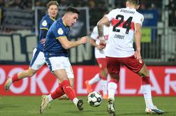 V Nemčiji brez senzacije, Slovenca izpadla proti velikanu